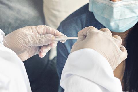 A doctor taking a coronavirus test