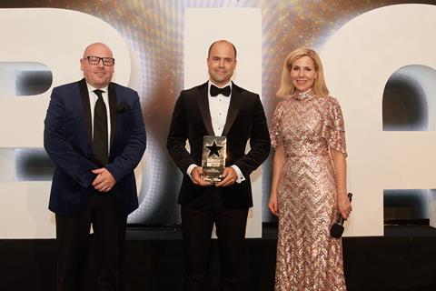 Sally Phillips (right) and Dawn Foods' sales director UK & Ireland Garry Russell present The Street Bakeshop owner Tim Goodwin with the first of two awards that night