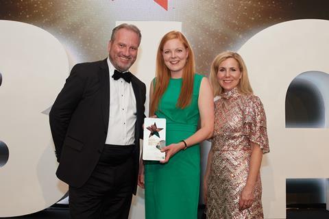 Aisling McGhee (centre) represents family business McGhee's Bakery to collect the Bakery Manufacturer of the Year award from Bako CEO Mike Tully (left) and comedian Sally Phillips