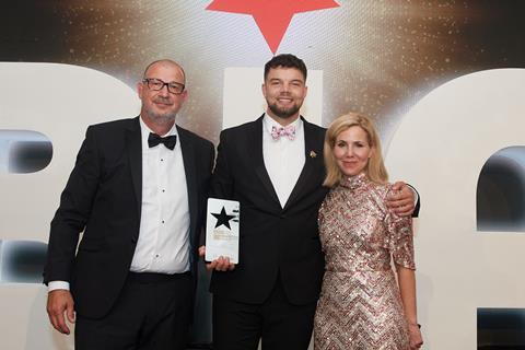 Project D's creative director Matthew Bond (centre) smiles with the Online Bakery Business of the Year award after receiving it from IFF's Laurent Venzi and Sally Phillips