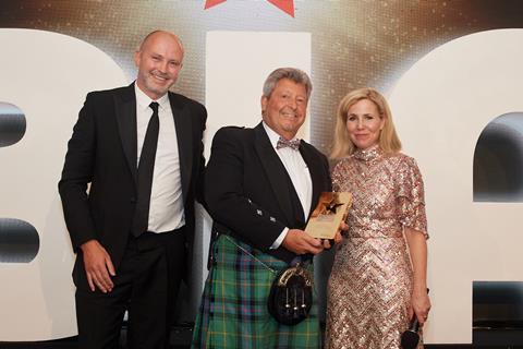 Smiles all round! A cheerful André Sarafilovic receives the Outstanding Contribution to the Baking Industry award from Délifrance's UK and Ireland general manager Niall Cogan (left) and celebrity host Sally Phillips