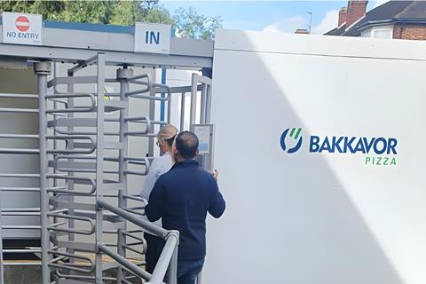 Workers enter the Bakkavor Pizza production site in Harrow