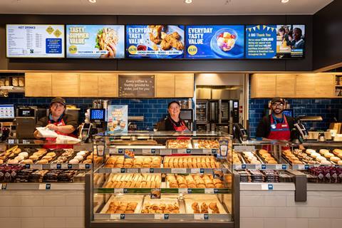 Three friendly looking staff behind a Greggs counter