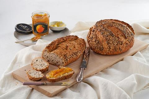 A seeded loaf of bread served with apricot conserve