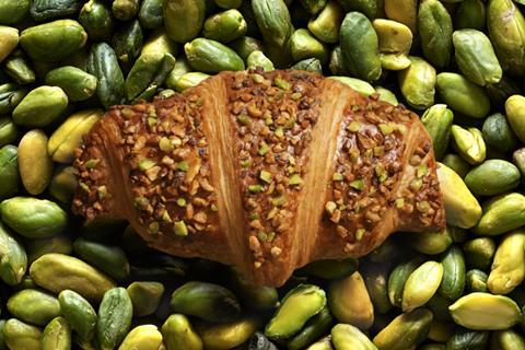 Bridor Pistachio & Almond Croissant on a bed of pistachios