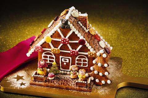A decorated gingerbread house with edible decorations