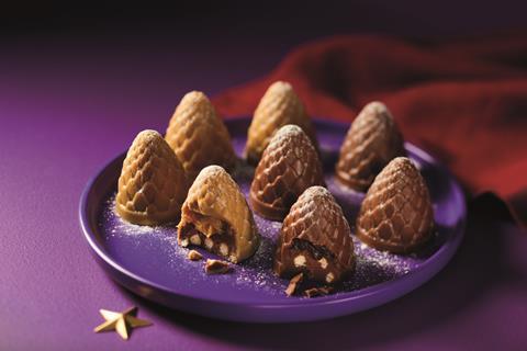 Chocolate shaped like pinecones with ganache and biscuit bits inside