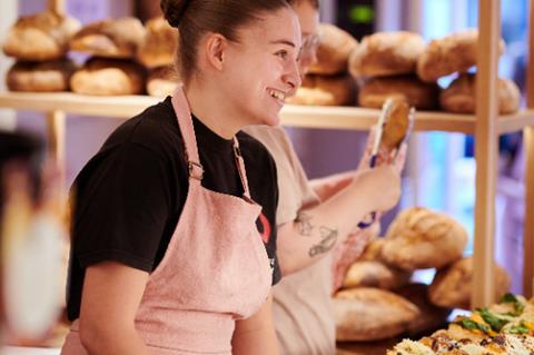 A staff member serves at Sourdough Sophia shop in Hampstead