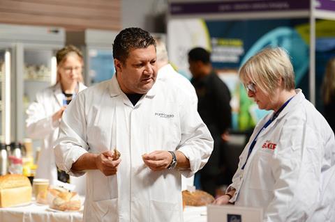 Lee Smith (left) discusses entries with fellow judge Clare Barton during Britain's Best Loaf 2023 at the NEC Birmingham.