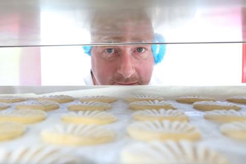 James Shepherd eyes a tray of Aberffraw biscuits
