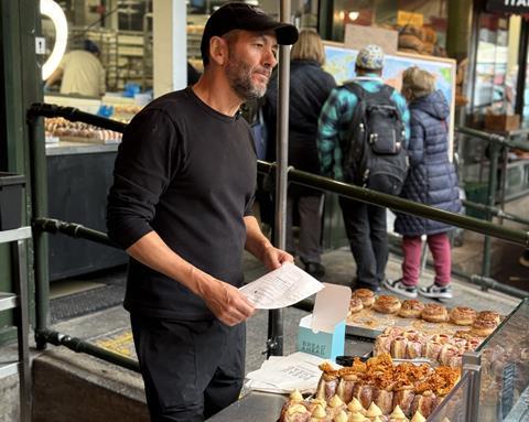 Bread Ahead - Founder Matthew Jones at the streetside doughnut kiosk of his flagship store at Borough Market