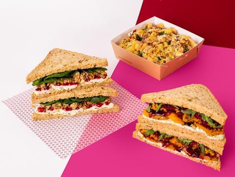 Pret's Christmas sandwiches and mac & cheese on a pink, white and red background