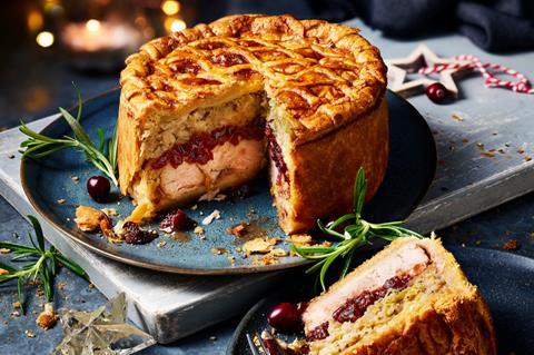 A layered turkey pie with stuffing and cranberry sauce inside