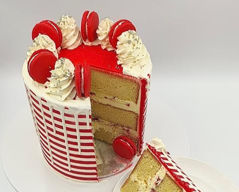 A red and white striped cake with vanilla sponge
