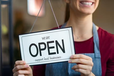 Shop open sign GettyImages-1221213467