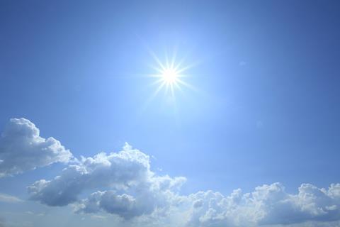 Sun high in a blue sky