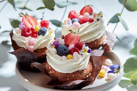 Muffins with cream and fruit on top