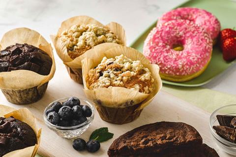 A pink ring doughnut, crumble topped muffin and chocolate cookie