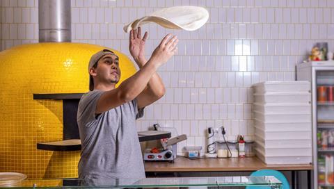 Image-1--Pizza-chef-handling-a-pizza-base cropped