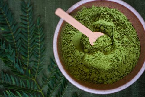 Green powder in a bowl