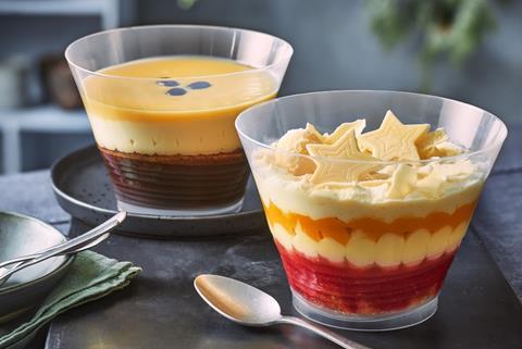 A layered espresso martini trifle and peach bellini trifle in bowls