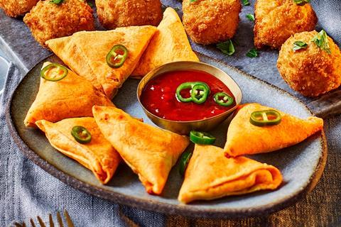 Nacho cheese pockets with jalapeno slices and a tomato dip