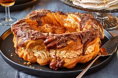 A choux wreath with cream and chocolate on top