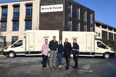 Bettys product director Paul Farr (front, second right) stands with colleagues, ProGreen head Michelle Miles (front, centre) and Prohire CEO Pat Skelly (front, second right) in front of the new electric vans. 2100x1400