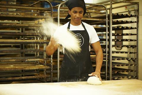 A worker prepares to shape dough at The Cavan Bakery's new production site in Walton-on-Thames  2100x1400