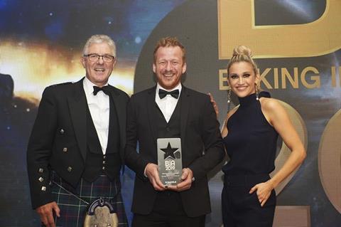 Keith Houliston in his trademark kilt at the Baking Industry Awards 2019 with Daniel Nemeth from Seasons Bakery and host Ashley Roberts