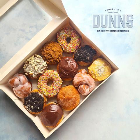 A selection of colourful doughnuts in a box