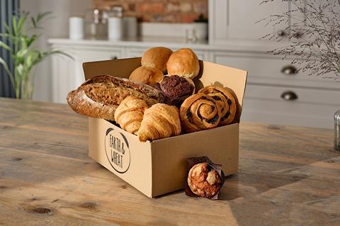 The Earth & Wheat bread box with sourdough loaf, muffins and pastries in