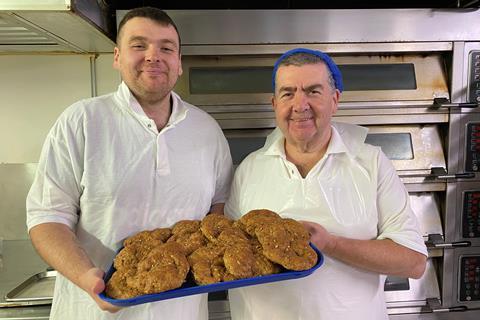 Hame Bakery owner Patrick Jackson (right) and his son, also a baker called Patrick, hold a tray of their new healthier butteries  - Food Standards Scotland