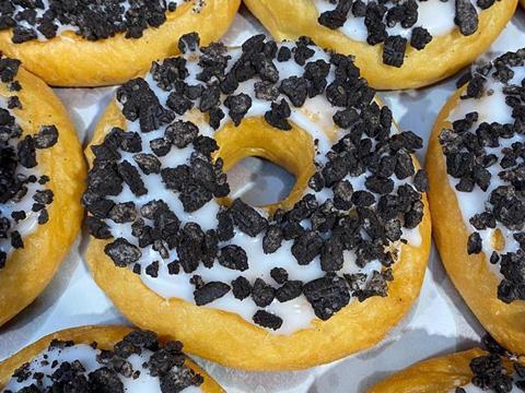 Ring doughnuts with white icing and Oreo pieces on top