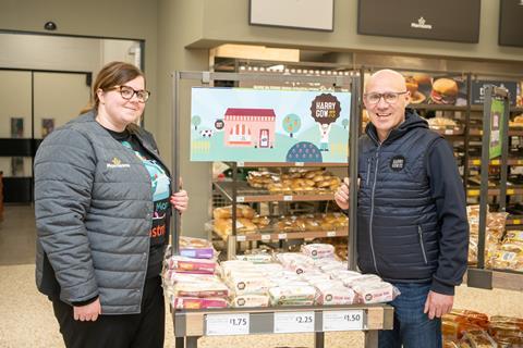 Ashleigh Campbell and David Gow next to bakery products in a Morrisons store