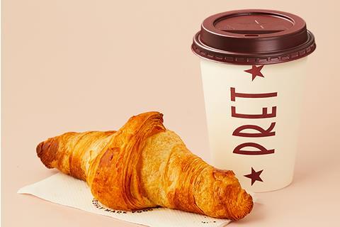 A Pret filter coffee in a to go cup and a croissant
