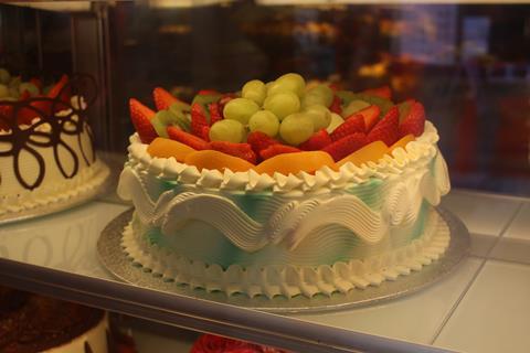 Golden Gate Cake Shop cake with fruit on top