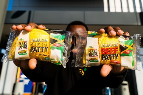 Flake Bake - Flake Bake co-founder Mike Williams holds up the new Chicken Patty and original Beef Patty in front of an Aldi store