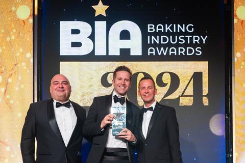 Jason's Sourdough sales and marketing director Barry Dawber (centre) collects the Bakery Brand of the Year award from Zeppelin MD Thierry Jahant (left) and host Scott Mills -  2100x1400
