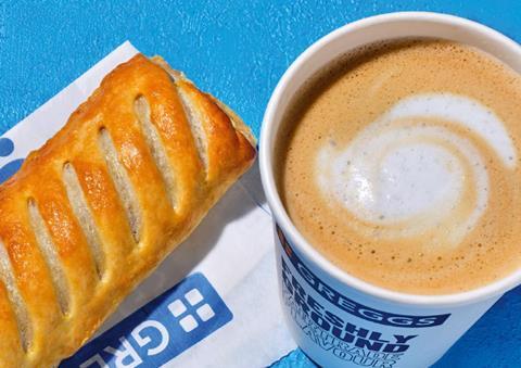 A close-up of a Greggs sausage roll and latte