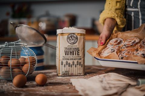 Matthews Cotswold Flour Stoneground Regenerative White Flour in a busy kitchen with a tray of freshly baked buns