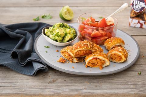 Cauliflower filled pastry rolls with guacamole and tomato salsa on a plate