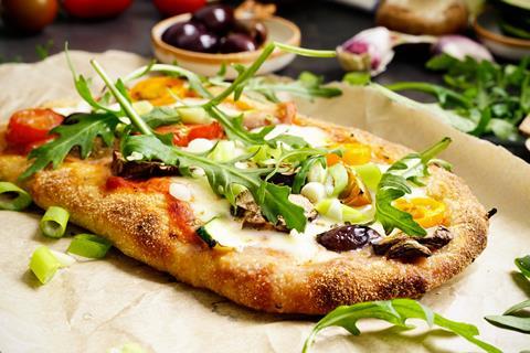 Pinsa pizza with rocket scatter over
