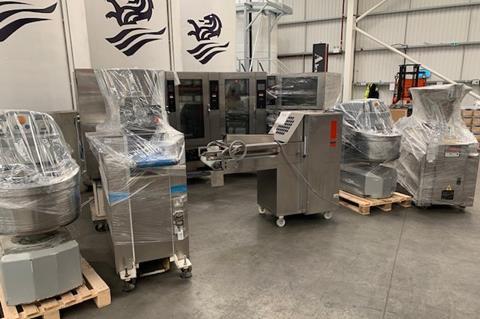 A selection of bakery equipment, including ovens and mixers, wrapped up ready to be transported