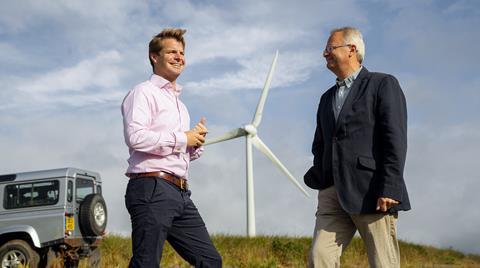Macphie site manager Ed Widdowson (left) and chairman Alaistair Macphie stand infront of one of their two 4.6mW Enercon E70 wind turbines next to their factory in Glenbervie.