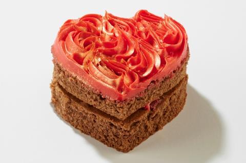 A heart shaped chocolate cake with red frosting