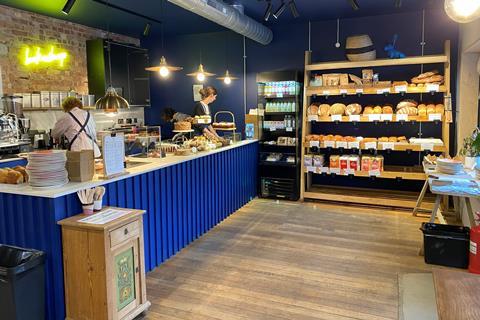 Inside a bakery with fresh loaves on display