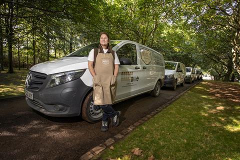 Sharn with the bakery's electric vehicles