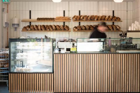 A bakery counter with sourdough loaves