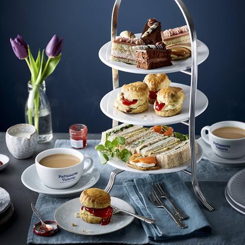 Afternoon tea with scones, cakes and sandwiches on a cake stand